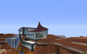 A Minecraft screenshot of a large building in a mesa biome. The building features concrete and a variety of terracotta with large areas of glass, and has curved walls and roofs throughout.