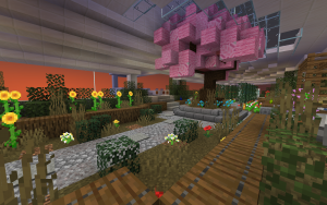 A Minecraft screenshot showing a blossoming cherry tree and the surrounding garden